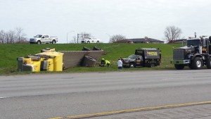 A semi truck hauling a 45,000-lb. steel coil rolled over Monday after the driver lost control during a sneeze. | Indiana State Police