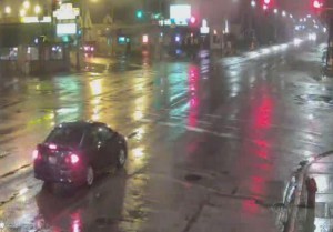 Surveillance footage of a car that police say struck and seriously injured a bicyclist before fleeing the Northwest Side scene. | Chicago Police