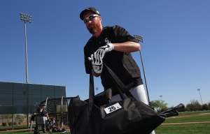 FILE - In this Feb. 26, 2016, file photo, Chicago White Sox's Adam LaRoche picks up his gear after taking live batting practice during a spring training baseball workout in Glendale, Ariz. LaRoche surprised the White Sox by retiring Tuesday, March 15, 2016, leaving $13 million on the table. (AP Photo/Ross D. Franklin, File)