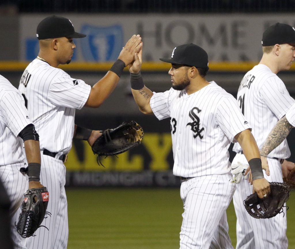 Chicago White Sox's Jose Abreu, left, and Melky Cabrera celebrate their win over the Minnesota Twins after a baseball game Friday, May 6, 2016, in Chicago. (AP Photo/Charles Rex Arbogast)