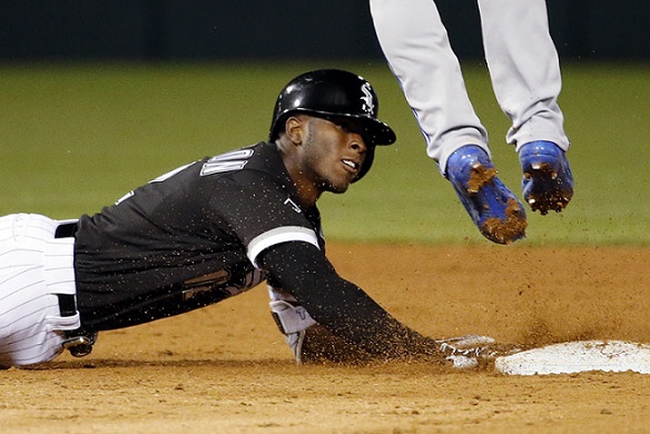 Chicago White Sox's Tim Anderson, left, slides safely into second base on a double during the seventh inning of a baseball game against the Toronto Blue Jays in Chicago, Friday, June 24, 2016. (AP Photo/Nam Y. Huh)