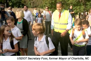 A local mayor walks with students. Photo from http://www.walkbiketoschool.org/