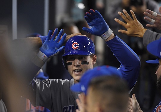 Chicago Cubs' Anthony Rizzo is congratulated after hitting a home run during the fifth inning of Game 4 of the National League baseball championship series against the Los Angeles Dodgers Wednesday, Oct. 19, 2016, in Los Angeles. (AP Photo/Mark J. Terrill)